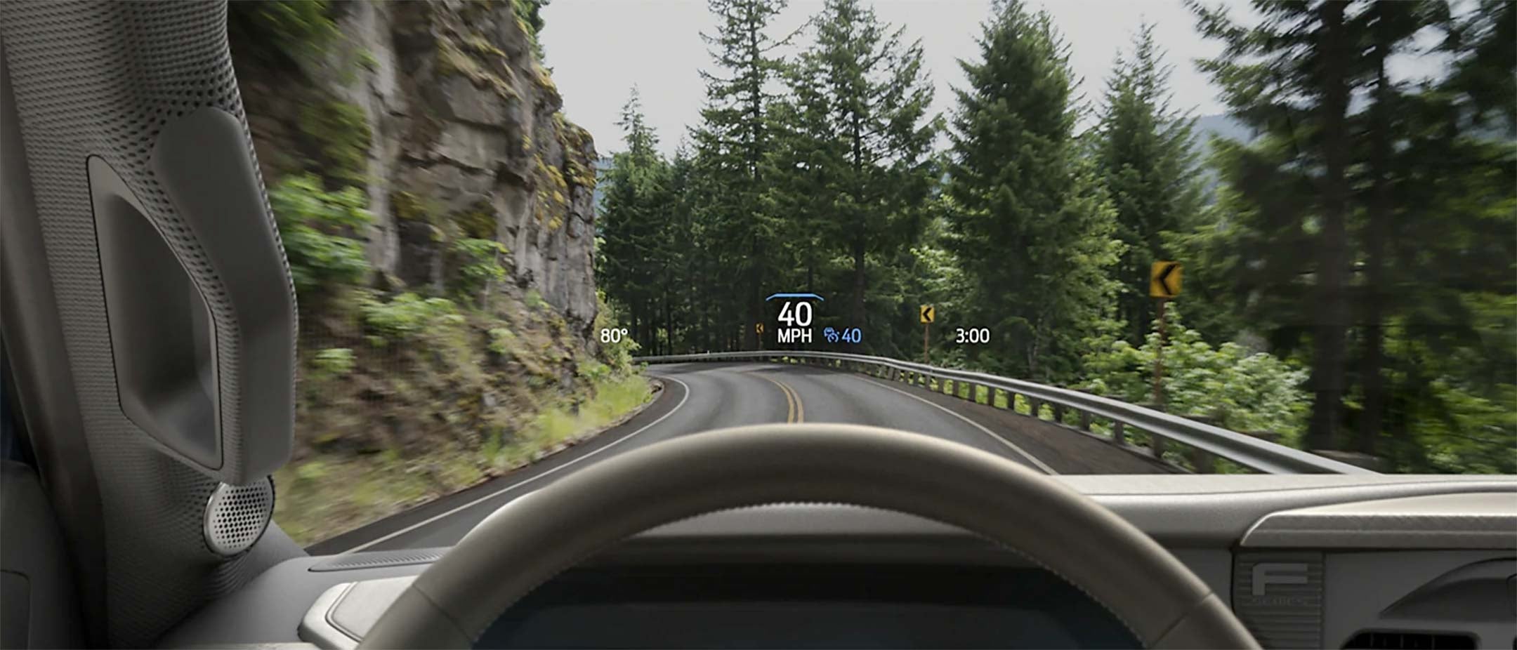 Driver perspective using head-up display feature highlighting the speed on to the windshield